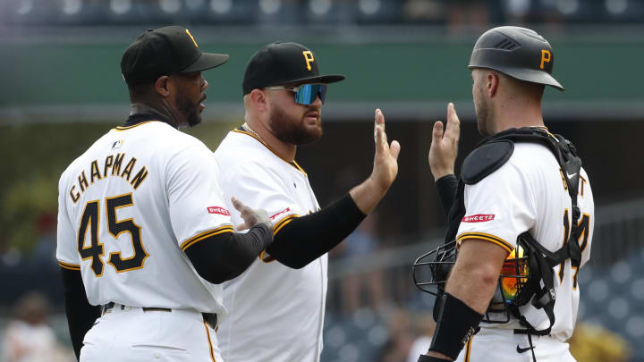 Jul 24, 2024; Pittsburgh, Pennsylvania, USA;  Pittsburgh Pirates relief pitcher Aroldis Chapman (45) and first baseman Rowdy Tellez (middle) and catcher Joey Bart (14)  celebrate after defeating the St. Louis Cardinals at PNC Park. Pittsburgh won 5-0. Mandatory Credit: Charles LeClaire-USA TODAY Sports