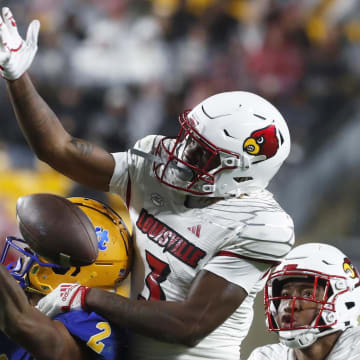 Oct 14, 2023; Pittsburgh, Pennsylvania, USA; Louisville Cardinals defensive back Quincy Riley (3) breaks up a pass intended for Pittsburgh Panthers wide receiver Kenny Johnson (2) during the third quarter at Acrisure Stadium. Pittsburgh won 38-21.