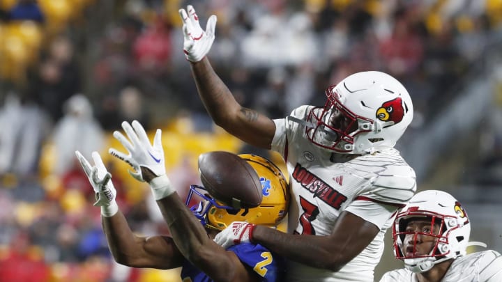 Oct 14, 2023; Pittsburgh, Pennsylvania, USA; Louisville Cardinals defensive back Quincy Riley (3) breaks up a pass intended for Pittsburgh Panthers wide receiver Kenny Johnson (2) during the third quarter at Acrisure Stadium. 