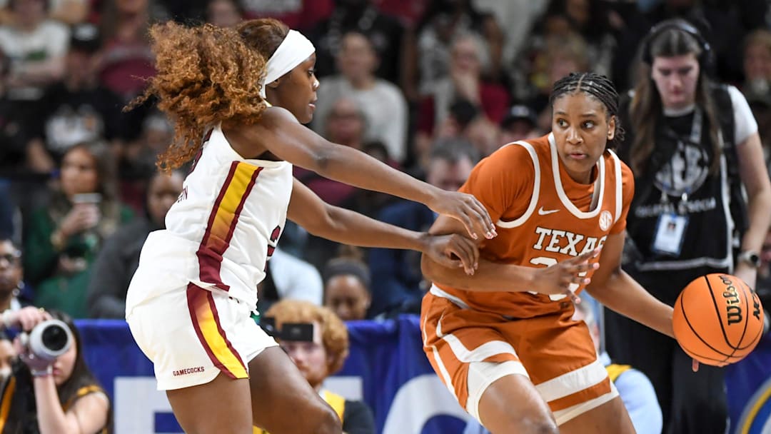 South Carolina Gamecocks guard Raven Johnson (25) defends Texas Longhorns forward Madison Booker (35) Sunday, March 8, 2026, during the SEC Women's Basketball Tournament Championship game at Bon Secours Wellness Arena in Greenville, South Carolina.