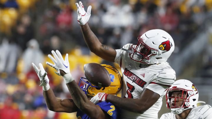 Oct 14, 2023; Pittsburgh, Pennsylvania, USA; Louisville Cardinals defensive back Quincy Riley (3) breaks up a pass intended for Pittsburgh Panthers wide receiver Kenny Johnson (2) during the third quarter at Acrisure Stadium.