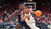 Louisville Cardinals guard Mikel Brown Jr. (0) drives by Bucknell Bison forward Ruot Bijiek (4) during an exhibition game at the KFC Yum! Center in Louisville, Kentucky Tuesday October 28, 2028.