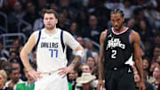 Apr 23, 2024; Los Angeles, California, USA; Dallas Mavericks guard Luka Doncic (77) and Los Angeles Clippers forward Kawhi Leonard (2) stand on the floor during the first quarter of game two of the first round for the 2024 NBA playoffs at Crypto.com Arena. Mandatory Credit: Kiyoshi Mio-Imagn Images