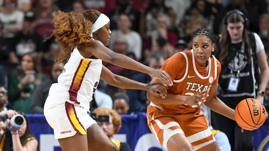 South Carolina Gamecocks guard Raven Johnson (25) defends Texas Longhorns forward Madison Booker