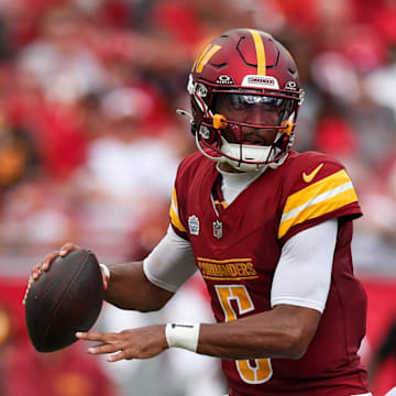 Sep 8, 2024; Tampa, Florida, USA; Washington Commanders quarterback Jayden Daniels (5) drops back to pass against the Tampa Bay Buccaneers in the third quarter at Raymond James Stadium. Mandatory Credit: Nathan Ray Seebeck-Imagn Images