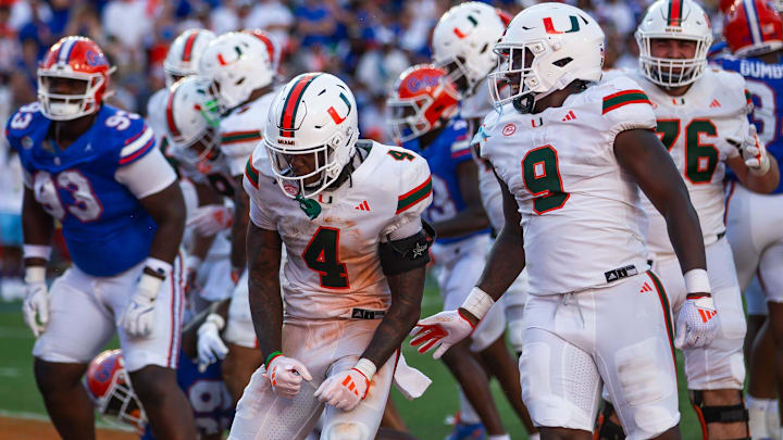 Miami Hurricanes running back Mark Fletcher Jr. (4) celebrates after goes up and over for a touchdown during the season opener at Ben Hill Griffin Stadium in Gainesville, FL on Saturday, August 31, 2024 against the University of Miami Hurricanes in the second half. Miami defeated the Gators 41-17. [Doug Engle/Gainesville Sun]