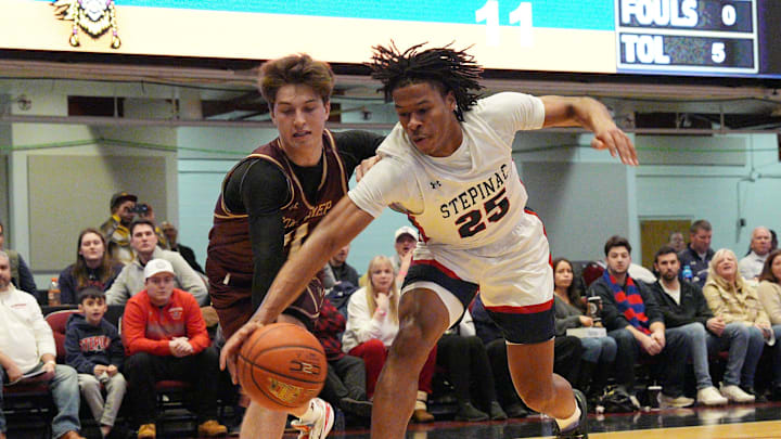 Stepinac's Jasiah Jervis (25) and Iona's Joe Wolf (11) battle for a loose ball during the Crusader Classic at the Westchester County Center in White Plains Jan. 4, 2025.