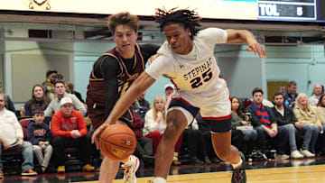 Stepinac's Jasiah Jervis (25) and Iona's Joe Wolf (11) battle for a loose ball during the Crusader Classic at the Westchester County Center in White Plains Jan. 4, 2025.