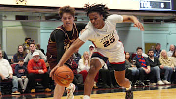 Stepinac's Jasiah Jervis (25) and Iona's Joe Wolf (11) battle for a loose ball during the Crusader Classic at the Westchester County Center in White Plains Jan. 4, 2025.
