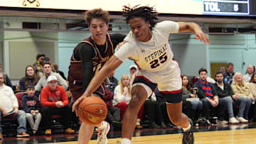 Stepinac's Jasiah Jervis (25) and Iona's Joe Wolf (11) battle for a loose ball during the Crusader Classic at the Westchester County Center in White Plains Jan. 4, 2025.