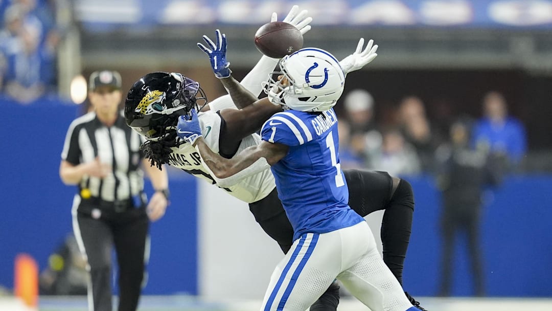 Dec 28, 2025; Indianapolis, Indiana, USA; Indianapolis Colts cornerback Sauce Gardner (1) breaks up a pass intended for Jacksonville Jaguars wide receiver Brian Thomas Jr. (7) during a game at Lucas Oil Stadium. 