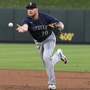 Seattle Mariners first baseman Luke Raley tosses to first base during a game against the St. Louis Cardinals on Saturday at Busch Stadium.