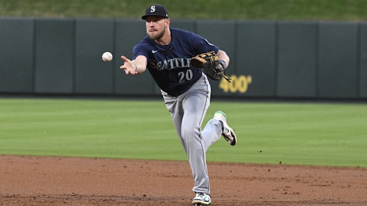 Seattle Mariners first baseman Luke Raley tosses to first base during a game against the St. Louis Cardinals on Saturday at Busch Stadium.