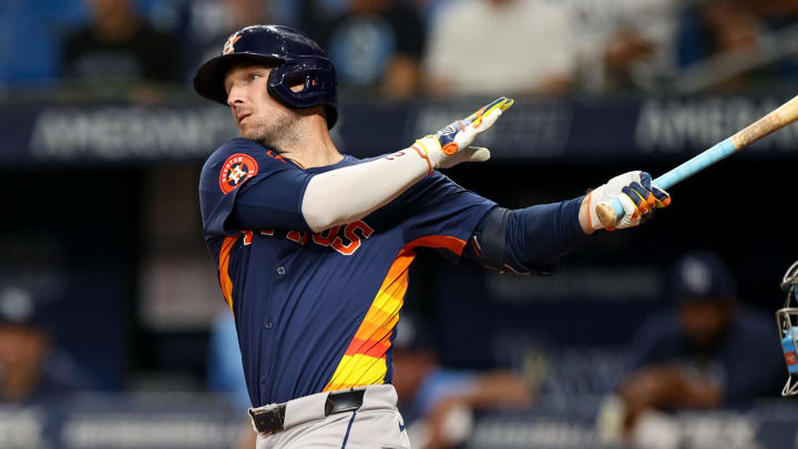 Aug 12, 2024; St. Petersburg, Florida, USA; Houston Astros third baseman Alex Bregman (2) hits a home run against the Tampa Bay Rays in the first inning  at Tropicana Field. Mandatory Credit: Nathan Ray Seebeck-USA TODAY Sports