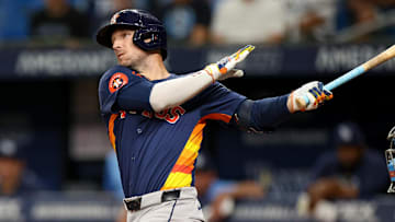 Aug 12, 2024; St. Petersburg, Florida, USA; Houston Astros third baseman Alex Bregman (2) hits a home run against the Tampa Bay Rays in the first inning  at Tropicana Field. Mandatory Credit: Nathan Ray Seebeck-Imagn Images