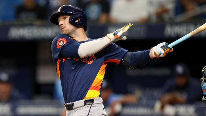 Aug 12, 2024; St. Petersburg, Florida, USA; Houston Astros third baseman Alex Bregman (2) hits a home run against the Tampa Bay Rays in the first inning  at Tropicana Field. 