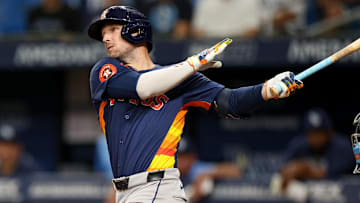 Aug 12, 2024; St. Petersburg, Florida, USA; Houston Astros third baseman Alex Bregman (2) hits a home run against the Tampa Bay Rays in the first inning  at Tropicana Field.