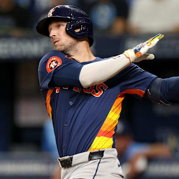 Aug 12, 2024; St. Petersburg, Florida, USA; Houston Astros third baseman Alex Bregman (2) hits a home run against the Tampa Bay Rays in the first inning  at Tropicana Field.