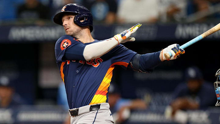 Aug 12, 2024; St. Petersburg, Florida, USA; Houston Astros third baseman Alex Bregman (2) hits a home run against the Tampa Bay Rays in the first inning  at Tropicana Field.