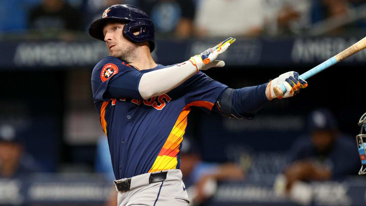 Aug 12, 2024; St. Petersburg, Florida, USA; Houston Astros third baseman Alex Bregman (2) hits a home run against the Tampa Bay Rays in the first inning  at Tropicana Field.