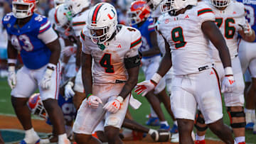 Miami Hurricanes running back Mark Fletcher Jr. (4) celebrates after goes up and over for a touchdown during the season opener at Ben Hill Griffin Stadium in Gainesville, FL on Saturday, August 31, 2024 against the University of Miami Hurricanes in the second half. Miami defeated the Gators 41-17. [Doug Engle/Gainesville Sun]
