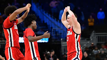 Mar 23, 2025; Milwaukee, WI, USA;  Mississippi Rebels guard Sean Pedulla (3) celebrates with teammates after defeating the Iowa State Cyclones in the second round of the NCAA Tournament at Fiserv Forum. Mandatory Credit: Benny Sieu-Imagn Images
