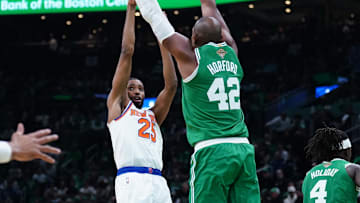Oct 22, 2024; Boston, Massachusetts, USA; New York Knicks forward Mikal Bridges (25) shoots against Boston Celtics center Al Horford (42) in the second half at TD Garden. Mandatory Credit: David Butler II-Imagn Images