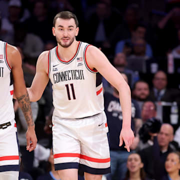 Mar 13, 2025; New York, NY, USA; Connecticut Huskies forward Jaylin Stewart (3) and forward Alex Karaban (11) during the second half against the Villanova Wildcats at Madison Square Garden. Mandatory Credit: Brad Penner-Imagn Images