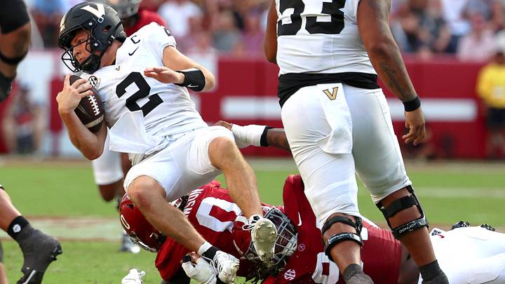 Oct 4, 2025; Tuscaloosa, Alabama, USA; Vanderbilt Commodores quarterback Diego Pavia (2) is tackled during the second half against the Alabama Crimson Tide at Saban Field at Bryant-Denny Stadium. Mandatory Credit: David Leong-Imagn Images
