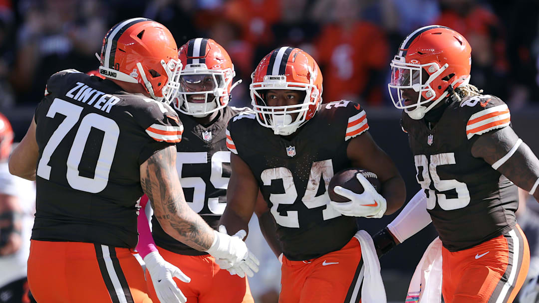Cleveland Browns running back Nick Chubb (24) celebrates his rushing touchdown with guard Zak Zinter (70) and tight end David Njoku (85) during the first half of an NFL football game against the Cincinnati Bengals at Huntington Bank Field, Sunday, Oct. 20, 2024, in Cleveland, Ohio.