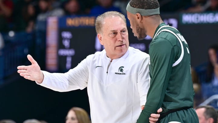 Nov 30, 2022; South Bend, Indiana, USA; Michigan State Spartans head coach Tom Izzo talks to guard Tre Holloman (5) in the first half against the Notre Dame Fighting Irish at the Purcell Pavilion. Mandatory Credit: Matt Cashore-USA TODAY Sports