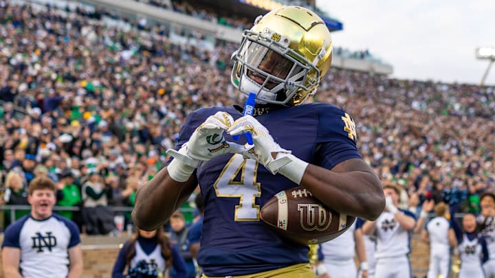 Nov 22, 2025; South Bend, Indiana, USA; Notre Dame Fighting Irish running back Jeremiyah Love (4) celebrates scoring against the Syracuse Orange during the first half at Notre Dame Stadium. Mandatory Credit: Michael Caterina-Imagn Images