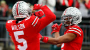 Sat., Nov. 20, 2021; Columbus, Ohio, USA; Ohio State Buckeyes wide receiver Garrett Wilson (5) celebrates after a touchdown with teammate Ohio State Buckeyes wide receiver Chris Olave (2) during the first quarter of a NCAA Division I football game between the Ohio State Buckeyes and the Michigan State Spartans at Ohio Stadium. Mandatory Credit: Joshua A. Bickel/Columbus Dispatch via USA TODAY Network.

Cfb Michigan State Spartans At Ohio State Buckeyes