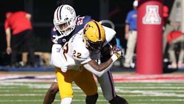 Nov 25, 2022; Tucson, Ariz., U.S.;  Arizona Wildcats cornerback Tacario Davis (23) attempts to tackle Arizona State Sun Devils wide receiver Bryan Thompson (22) during the Territorial Cup rivalry game at Arizona Stadium.