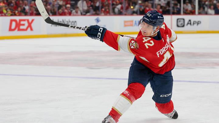 Dec 30, 2025; Sunrise, Florida, USA; Florida Panthers defenseman Gustav Forsling (42) shoots the puck against the Montreal Canadiens during the third period at Amerant Bank Arena. Mandatory Credit: Sam Navarro-Imagn Images