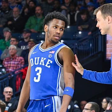 Duke basketball guard Jeremy Roach and head coach Jon Scheyer