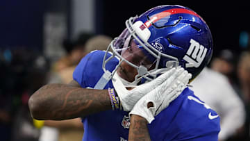 Sep 14, 2025; Arlington, Texas, USA; New York Giants wide receiver Malik Nabers (1) reacts after scoring a touchdown during the fourth quarter at AT&T Stadium. Mandatory Credit: Raymond Carlin III-Imagn Images