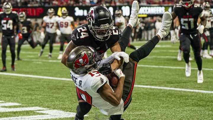 Jan 8, 2023; Atlanta, Georgia, USA; Tampa Bay Buccaneers wide receiver Russell Gage (17) catches a touchdown pass behind Atlanta Falcons cornerback A.J. Terrell (24) during the first half at Mercedes-Benz Stadium. Mandatory Credit: Dale Zanine-USA TODAY Sports