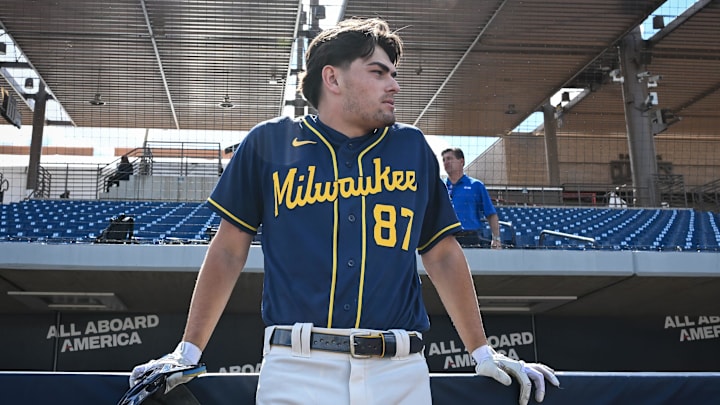 Milwaukee Brewers infield prospect Brady Ebel leans along the dugout rail during spring training workouts Tuesday, February 17, 2026, at American Family Fields of Phoenix in Phoenix, Arizona.