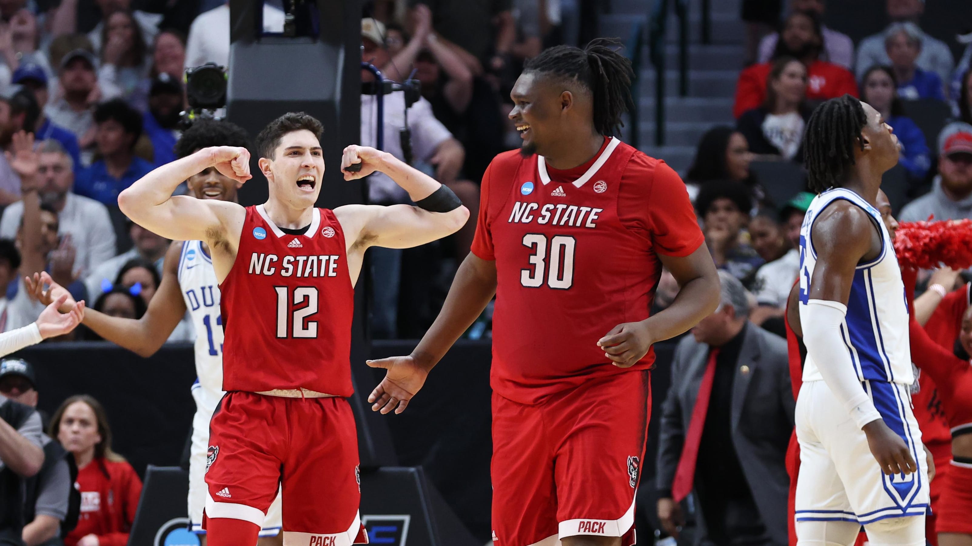 North Carolina State Wolfpack guard Michael O'Connell (12) flexes after beating Duke to advance to the Final Four. 