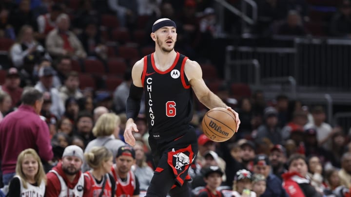 Apr 1, 2024; Chicago, Illinois, USA; Chicago Bulls guard Alex Caruso (6) drives to the basket against the Atlanta Hawks during the first half at United Center. Mandatory Credit: Kamil Krzaczynski-USA TODAY Sports