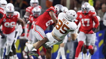 Jan 10, 2025; Arlington, Texas, USA; Ohio State Buckeyes safety Sonny Styles (6) hits Texas Longhorns tight end Gunnar Helm (85) during the second quarter of the College Football Playoff semifinal in the Cotton Bowl at AT&T Stadium. Mandatory Credit: Tim Heitman-Imagn Images