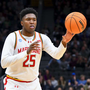 Mar 23, 2025; Seattle, WA, USA; Maryland Terrapins center Derik Queen (25) passes the ball against the Colorado State Rams in the first half at Climate Pledge Arena. Mandatory Credit: Steven Bisig-Imagn Images