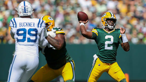 Green Bay Packers quarterback Malik Willis passes the ball as Elgton Jenkins blocks against the Indianapolis Colts on Sunday,