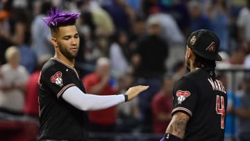 Sep 19, 2023; Phoenix, Arizona, USA; Arizona Diamondbacks left fielder Lourdes Gurriel Jr. (12) and second baseman Ketel Marte (4) celebrate after beating the San Francisco Giants 804 at Chase Field. Mandatory Credit: Matt Kartozian-USA TODAY Sports