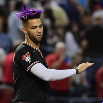 Sep 19, 2023; Phoenix, Arizona, USA; Arizona Diamondbacks left fielder Lourdes Gurriel Jr. (12) and second baseman Ketel Marte (4) celebrate after beating the San Francisco Giants 804 at Chase Field. Mandatory Credit: Matt Kartozian-USA TODAY Sports