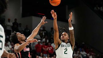 Mar 8, 2025; Waco, Texas, USA; Baylor Bears guard Jayden Nunn (2) scores a three-point basket against Houston Cougars guard L.J. Cryer (4) during the second half at Paul and Alejandra Foster Pavilion. Mandatory Credit: Chris Jones-Imagn Images