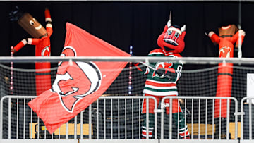 The New Jersey Devils mascot waves a flag at Prudential Center. Mandatory Credit: Vincent Carchietta-Imagn Images