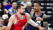 Feb 13, 2025; Salt Lake City, Utah, USA; LA Clippers center Ivica Zubac (40) turns into Utah Jazz forward/center John Collins (20) and forward/center Lauri Markkanen (23) during the first half at the Delta Center. Mandatory Credit: Christopher Creveling-Imagn Images