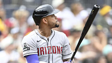 Sep 28, 2025; San Diego, California, USA; Arizona Diamondbacks second baseman Ketel Marte (4) hits a solo home run during the first inning against the San Diego Padres at Petco Park. Mandatory Credit: Denis Poroy-Imagn Images